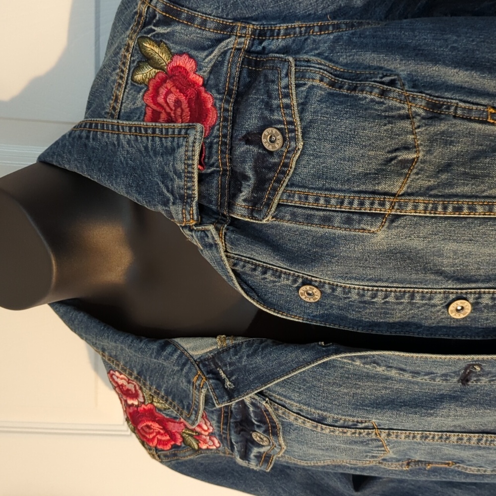 Denim jacket with floral appliques